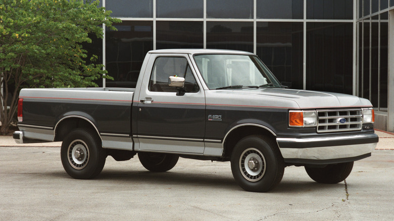 A 1986 Ford F-150 sits parked.