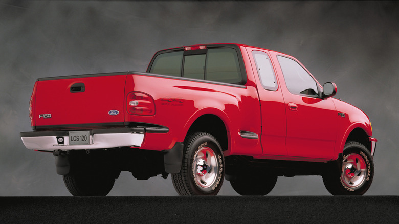A 1997 Ford F-150 sits parked.