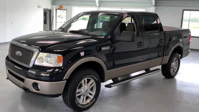 A 2006 Ford F-150 parked in a garage.