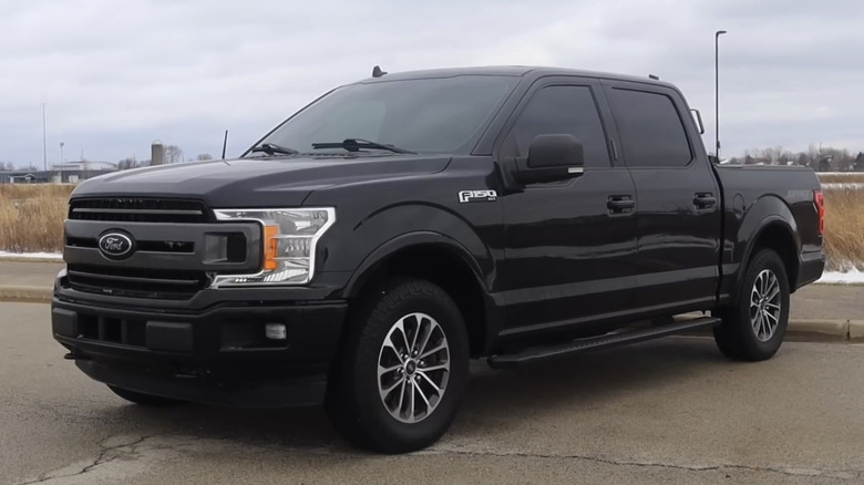 A black 2018 Ford F-150 sits parked.