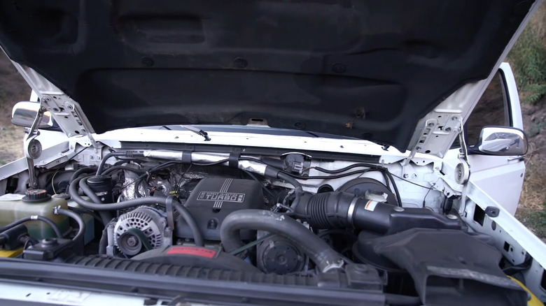 A Ford/Navistar 7.3-liter Power Stroke turbodiesel engine in a white Super Duty Ford truck