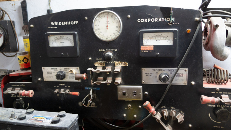 A close-up image of a black antique engine analyzer.
