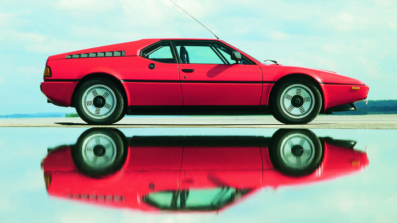 Side profile of a red BMW M1.