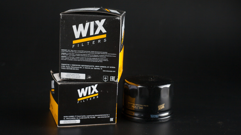 Wix oil filters are shown against a black background.