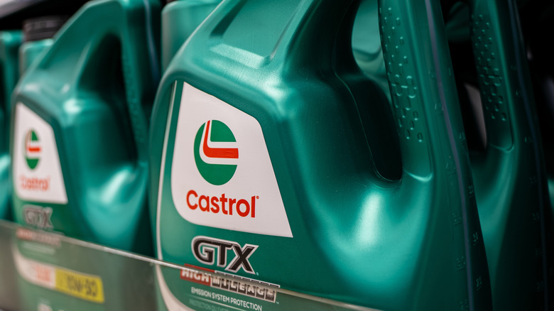 A close-up of motor oil on a shelf.