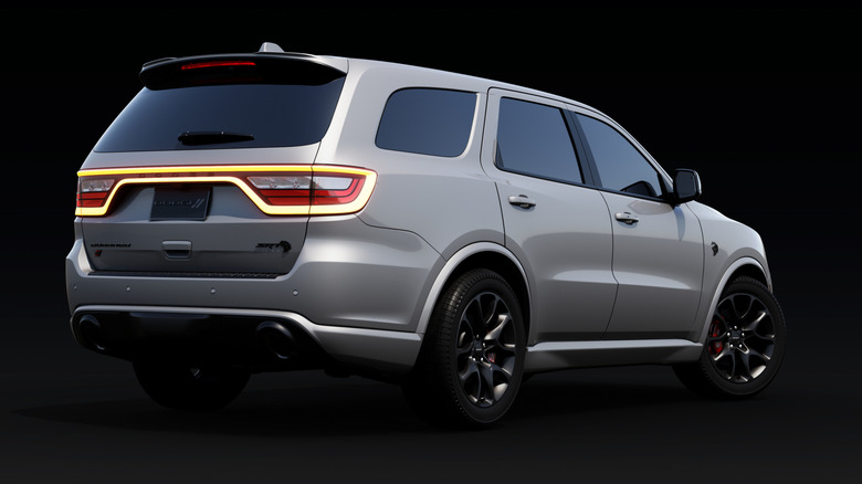 Silver 2025 Dodge Durango SUV right rear three-quarter view studio shot