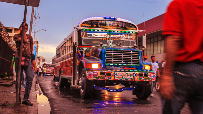 A colorful Red Devil bus on the job in Panama City.