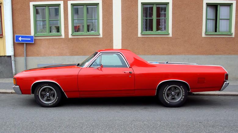 Red Chevy El Camino parked connected nan street