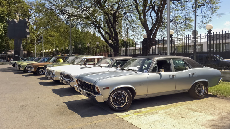 Line of Chevy Nova cars successful an outdoor parking lot