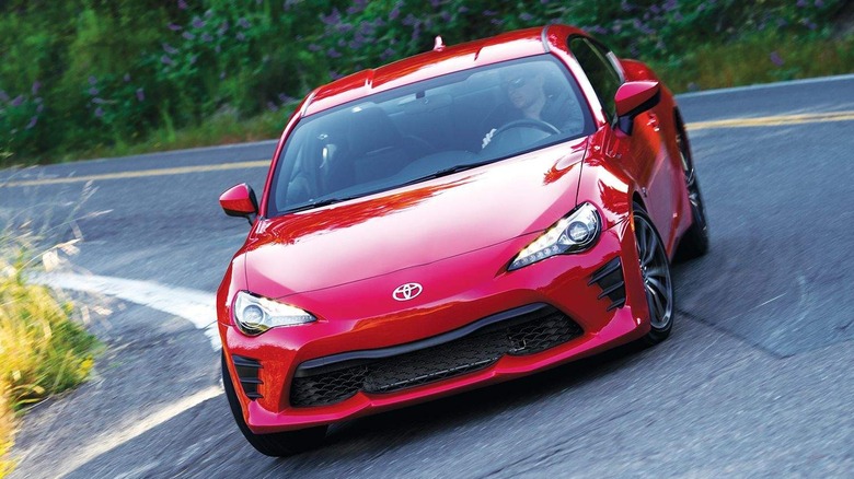 A red 2017 Toyota 86 cornering down a road