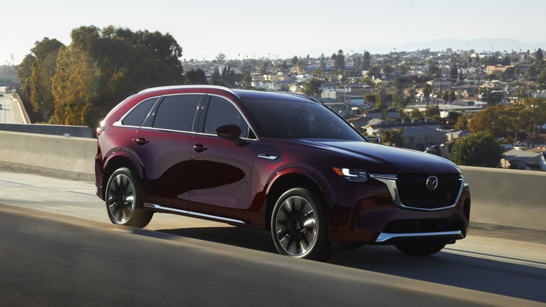 2024 Mazda CX-90 front 3/4 view while driving