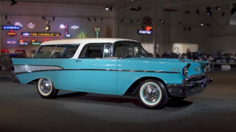 Side profile image of a blue 1957 Chevrolet Bel Air Nomad.