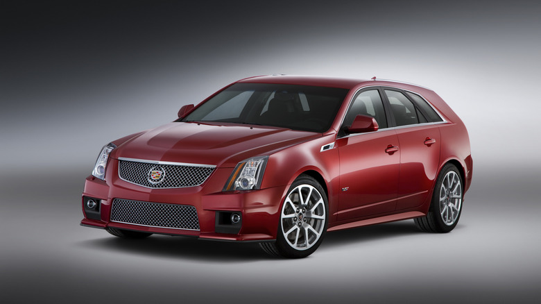 A red 2011 Cadillac CTS-V Sport Wagon pictured against dark background.