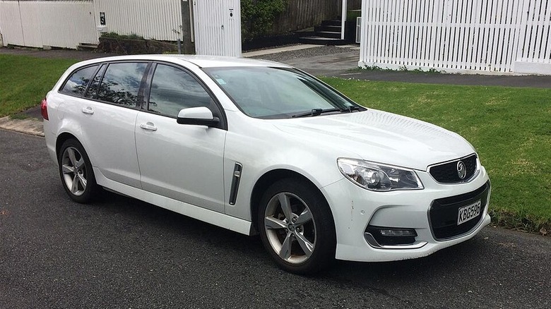 Front three-quarter image of a white 2017 Holden Commodore wagon.