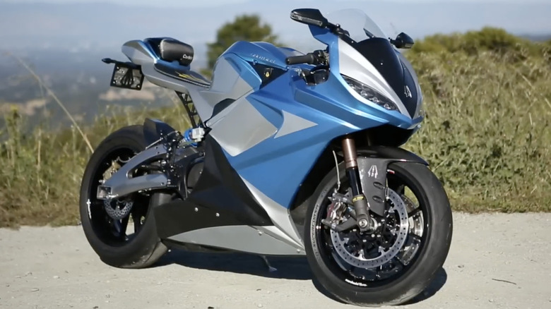 A silver and blue Lightning Motorcycles LS-218 parked outside