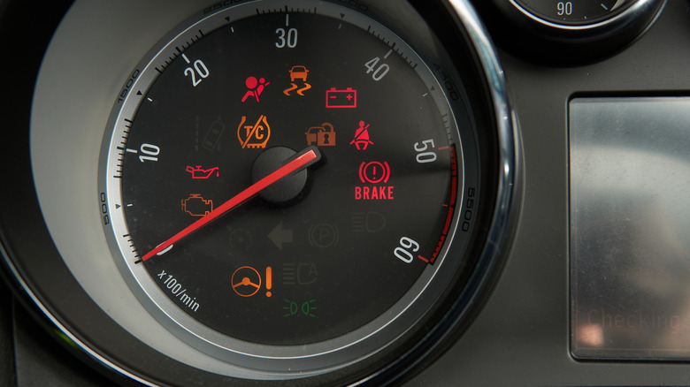 A variety of warning lights appear in a gauge cluster.