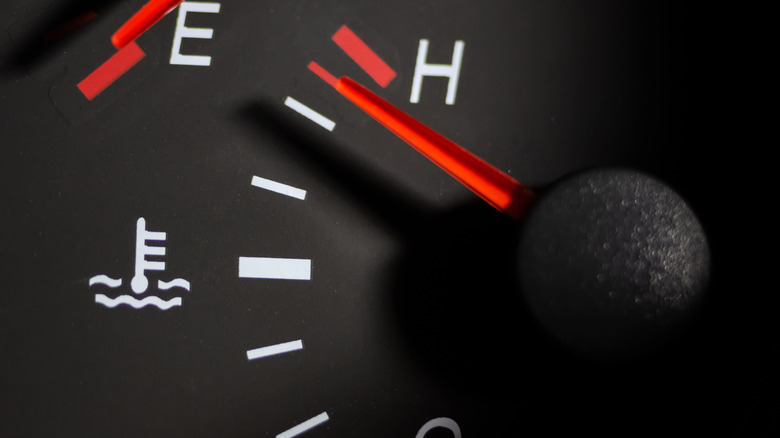 A car's temperature gauge reads very high.