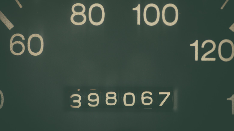 Closeup of an odometer that reads 398,067 miles.
