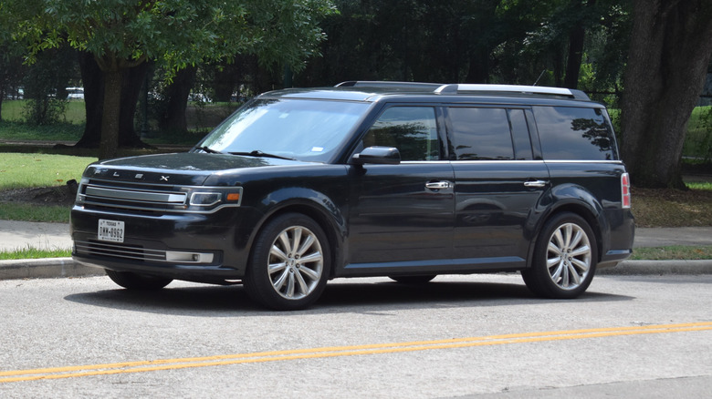 A Ford Flex sits parked.