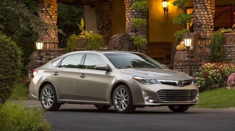 A Toyota Avalon sits parked on a driveway.
