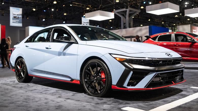 A hyundai Ioniq 6 sedan on the floor of the New York Auto Show in 2024