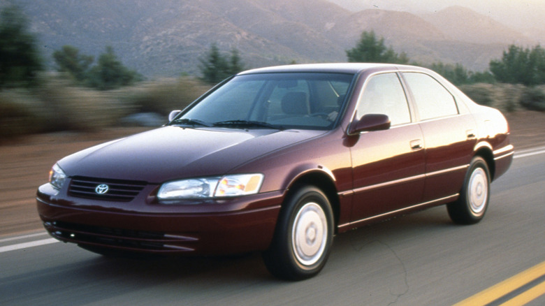 1997 Toyota Camry driving along a mountain highway