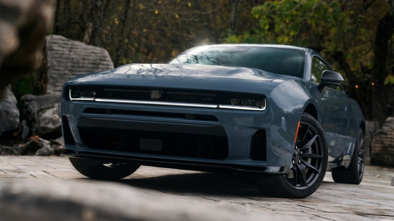 Front 3/4 view of a blue-gray 2026 Dodge Charger.