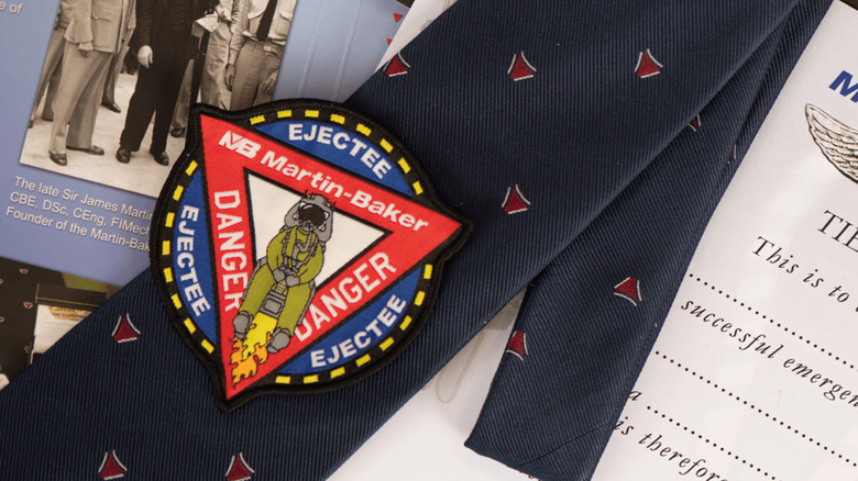 The Martin-Baker Tie Club patch sitting on top of the navy blue tie given to members