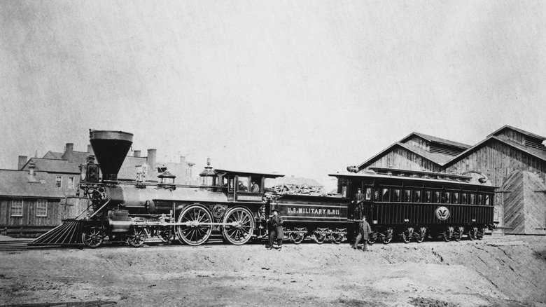 The Lincoln funeral train with people standing near it.