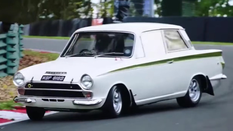 A Lotus Cortina Mk 1 being raced on a race track.