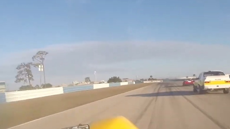 Brian Johnson racing his bright yellow, fully functional Royale RP4 race car at Sebring.