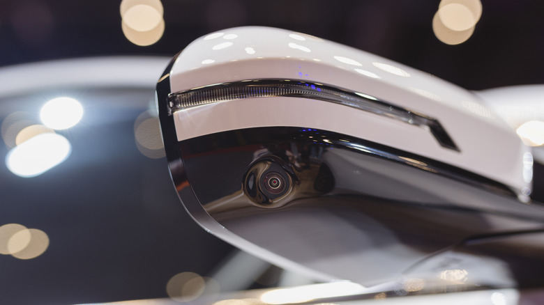Original equipment manufacturer side view mirror with a camera.
