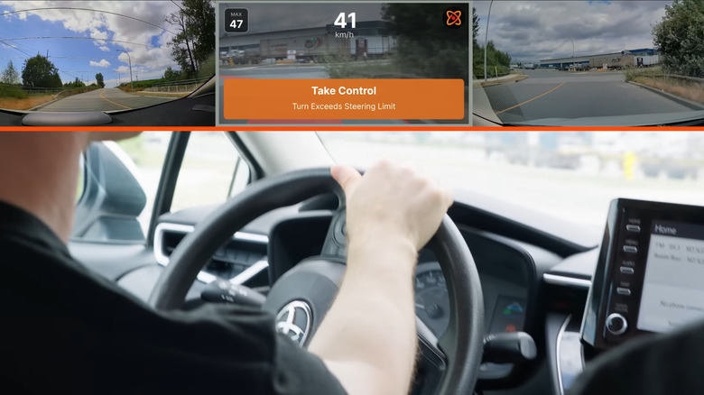 A driver being alerted to take control of the vehicle from an aftermarket ADAS device as it approaches a bend at 41 km/h.