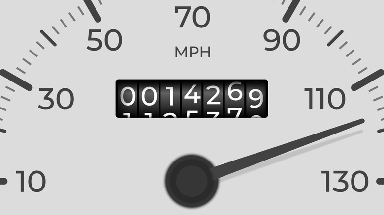 A close-up view of a white odometer rolling.