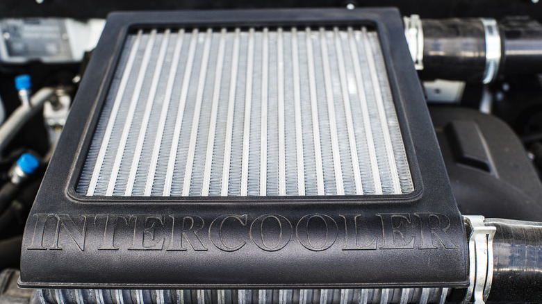 A horizontal new intercooler inside a car