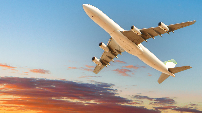 A commercial airliner climbing after takeoff