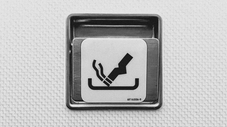 An ashtray installed in an airplane bathroom