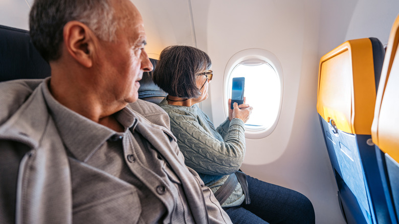 Taking a photo out the window of an airplane