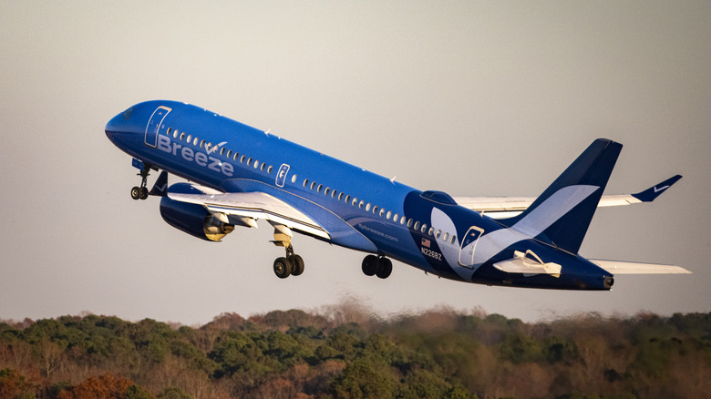 Breeze Airways Airbus A220-300 plane takes off at Raleigh-Durham International Airport (RDU) en route Windsor Locks, Connecticut on November 24, 2025 in Morrisville, North Carolina.