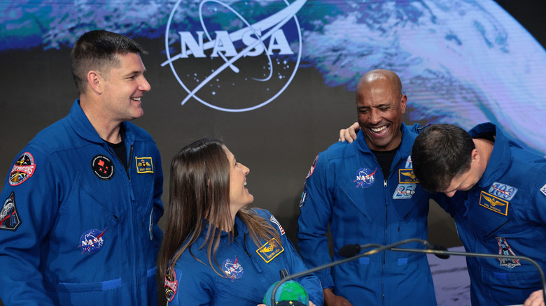 Artemis II crew members Jeremy Hansen, Christina Koch, Victor Glover, and Reid Wiseman share a laugh together