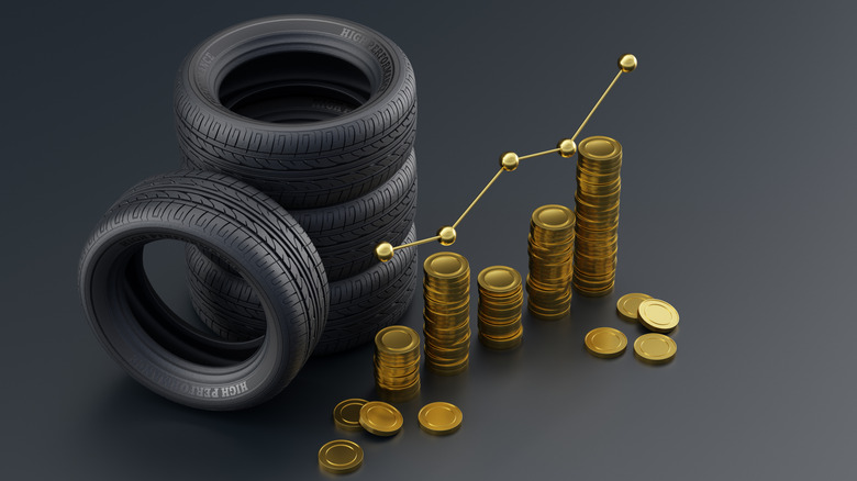 Illustration showing a stack of tires against coins depicting their costs.