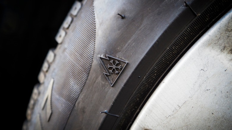 The Three-Peak Mountain Snowflake (3PMSF) symbol on the sidewall of a tire.