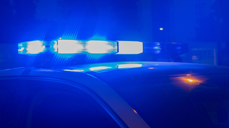 Blue police lights lit up at night