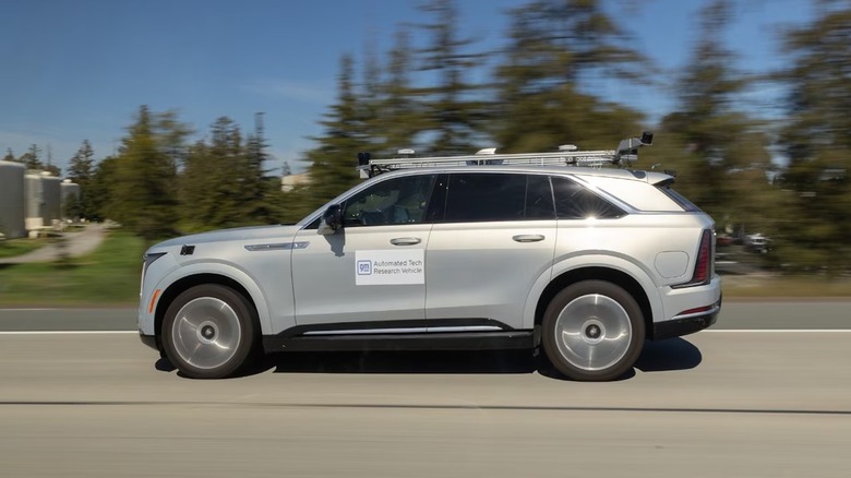 A silver Cadillac Escalade IQ autonomous driving test mule.