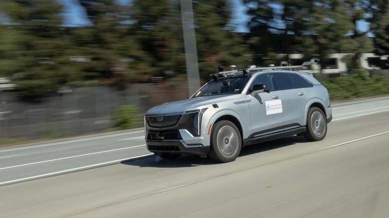 A silver Cadillac Escalade IQ autonomous driving test mule.