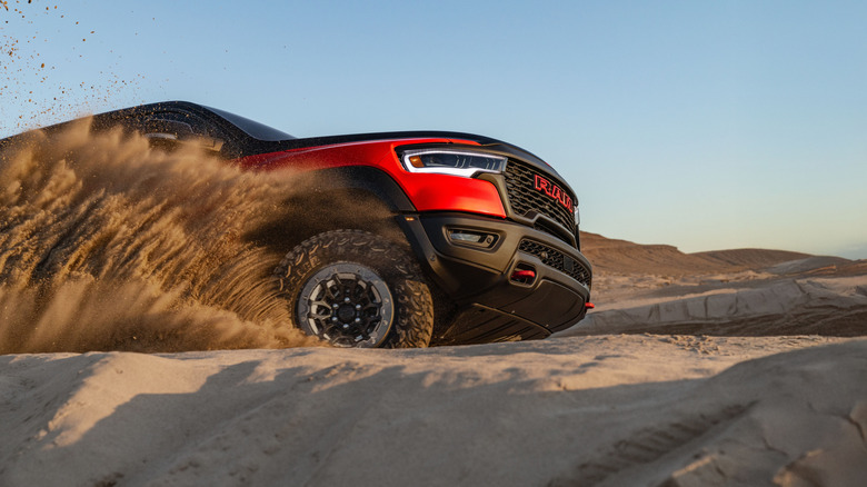 An orange Ram TRX in sand