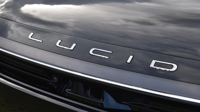 Beesd, the Netherlands - September 12, 2025: close up shot, the Lucid emblem of a black Lucid Gravity