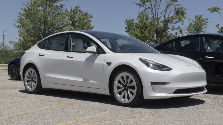 A 2021 Tesla Model 3 for sale on a dealer lot