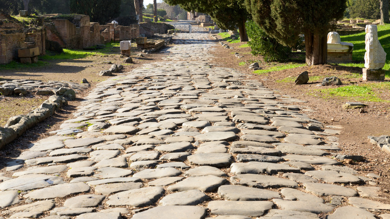 One of the ancient Roman roads, the cobblestones still very intact after two millennia, in Italy.