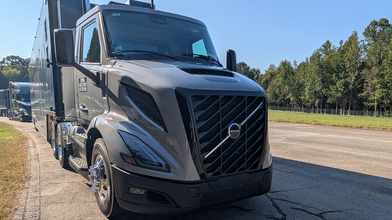 A gray Volvo VNL Semi truck parked at the Michelin Laurens Proving Grounds on a sunny day